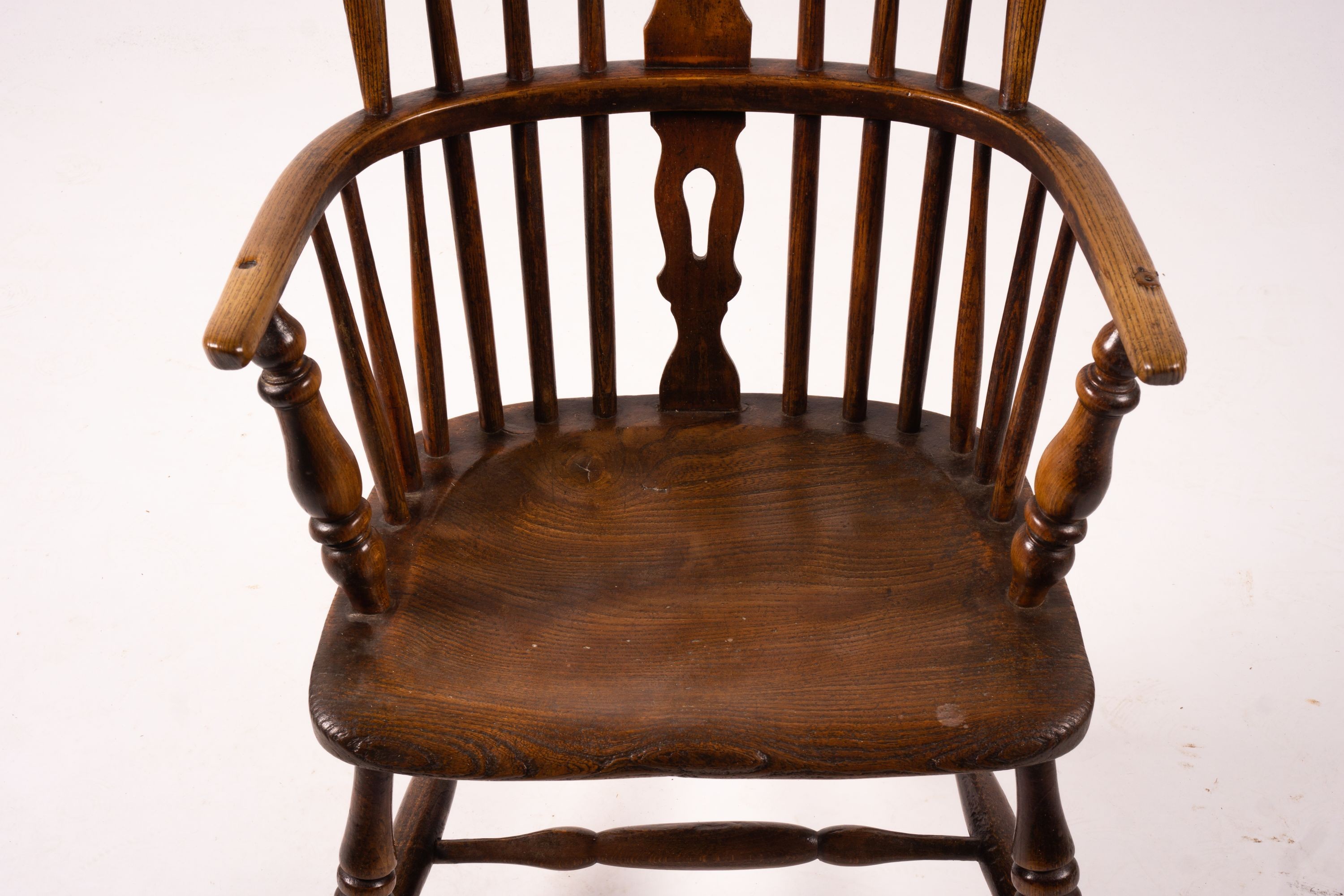 An early 19th century ash, elm and fruitwood Derbyshire area Windsor armchair with 'H' stretcher, width 56cm, depth 44cm, height 106cm